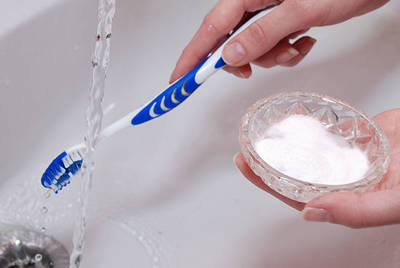 brushing teeth with baking soda and water