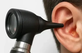 Otitis Media with Effusion diagnosis using otoscope — close-up of ear examination, showing ear canal and signs of middle ear fluid. No face visible. Keywords: otoscope, ear exam, glue ear, OME symptoms, middle ear fluid, pediatric ENT, ear infection check.